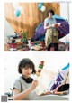 A woman holding a skewer of food in front of a tent.