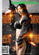 a chinese movie poster with a woman holding a gun